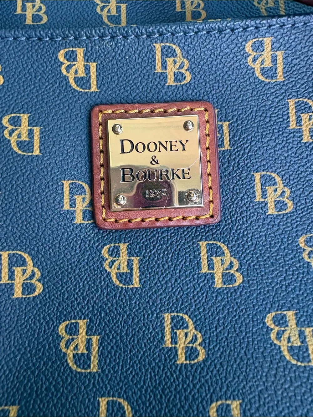 Dooney & Bourke navy with Brown Trim Monogram Crossbody